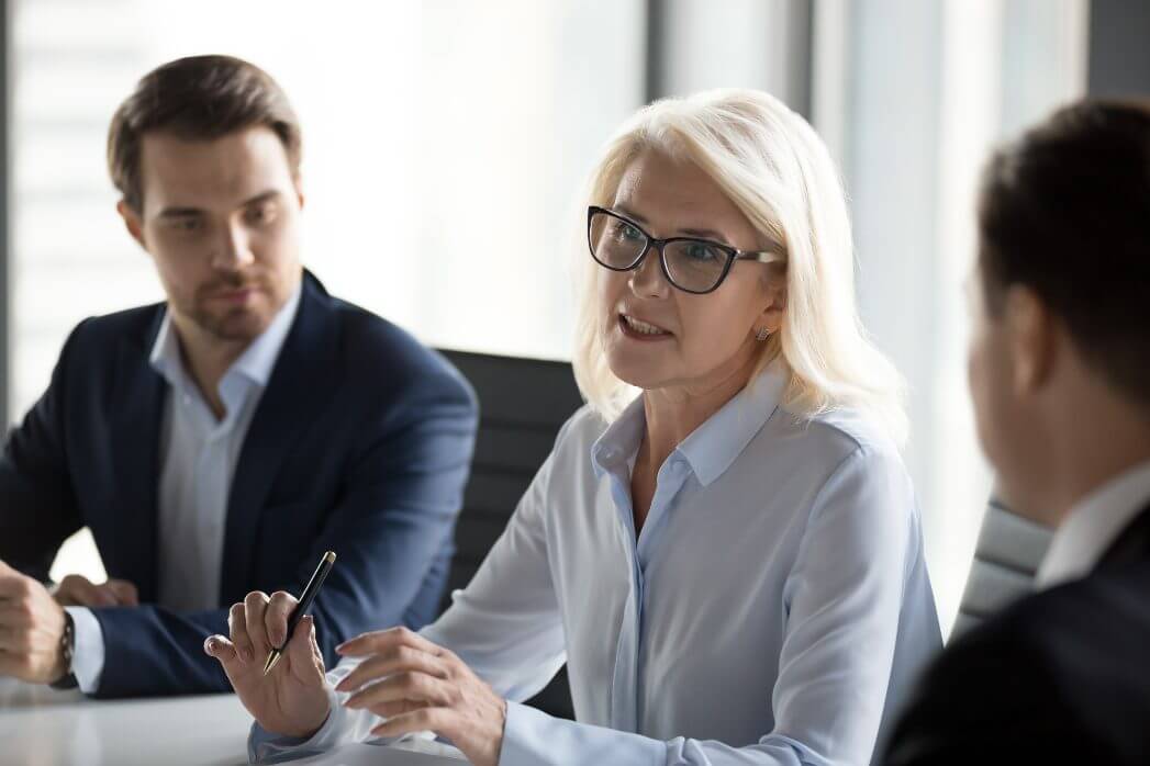 Middle-aged business woman leading a meeting