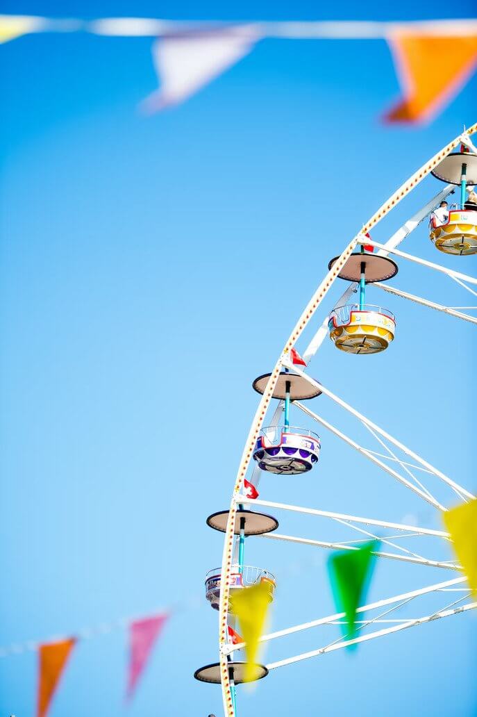 People on a Ferris wheel in a fairground